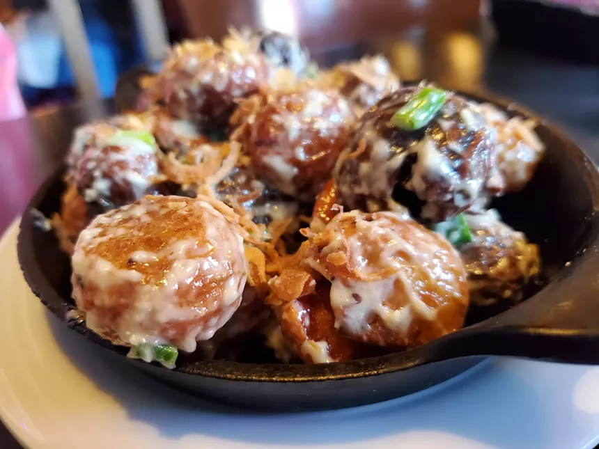 smal, whole potatoes covered in a creamy white sauce