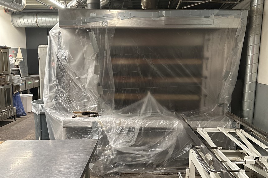 A bread oven sealed in plastic wrap