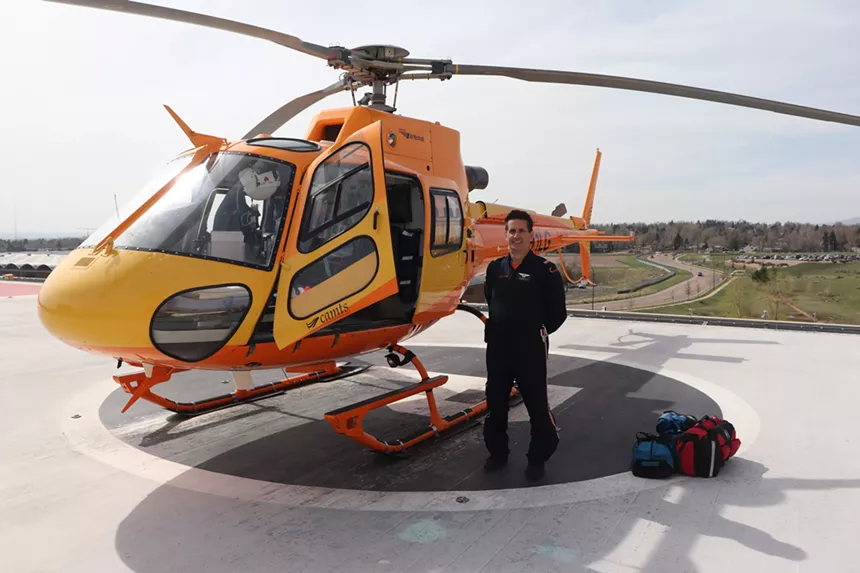 Dan Gormley with the helicopter "Lifeguard 1" in Lakewood, Colorado.