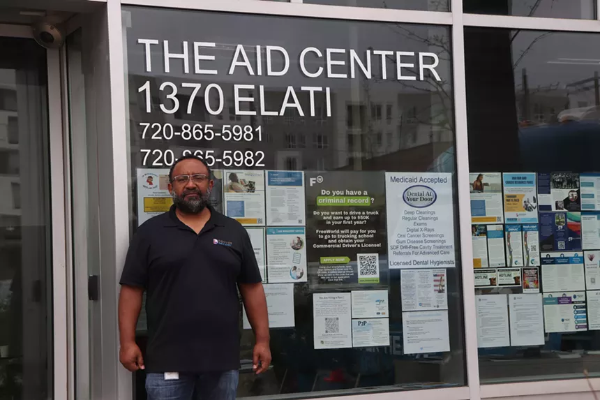 Carlon Manuel outside AID Center office