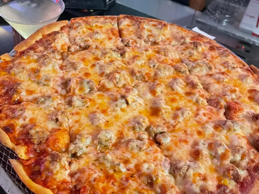 a sausage and cheese pizza