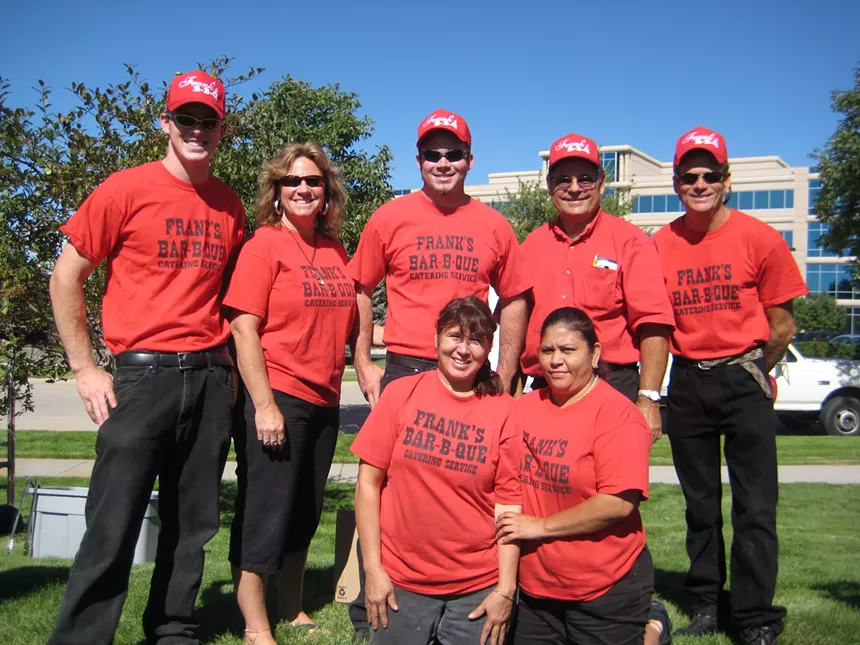 a group of people in red shirts