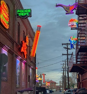 buildings with neon signs