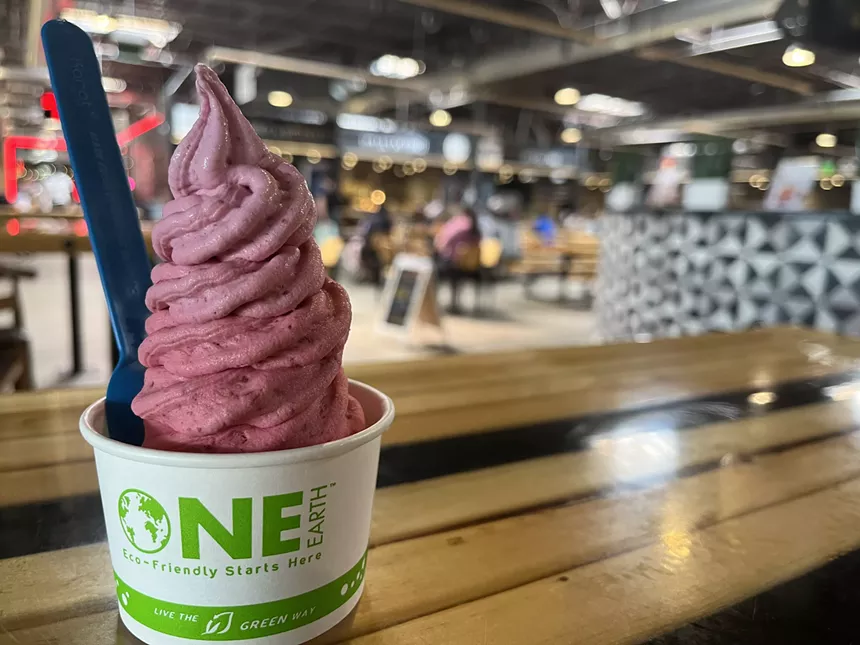soft serve ice cream in a cup with a spoon