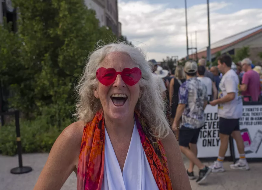 woman in heart shaped sunglasses