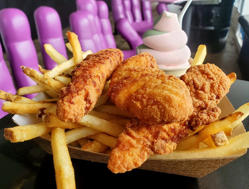 a basket of chicken tenders and french fries