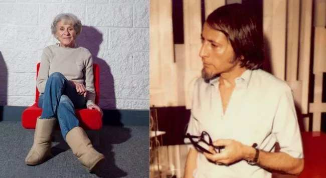 an old woman sitting on the ground and a young man with long hair
