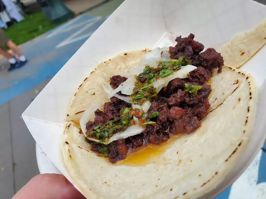 a sausage tacos with green salsa