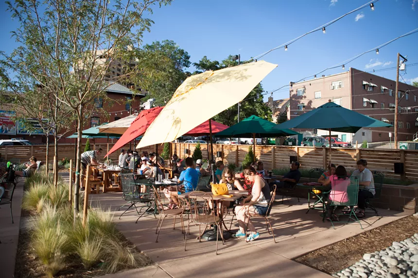 patio with tables and umbrellas