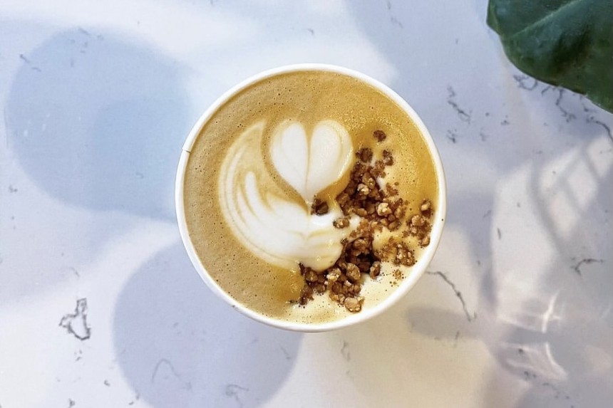 Latte art topped with toffee pieces
