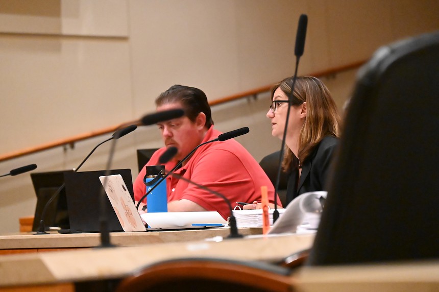 Attorney Suzanne Tehari argues in the Aurora City Council chambers during a protest hearing.