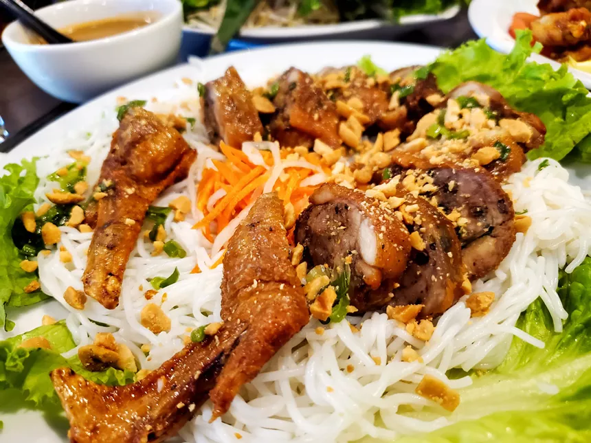 a platter of rice noodle and chicken