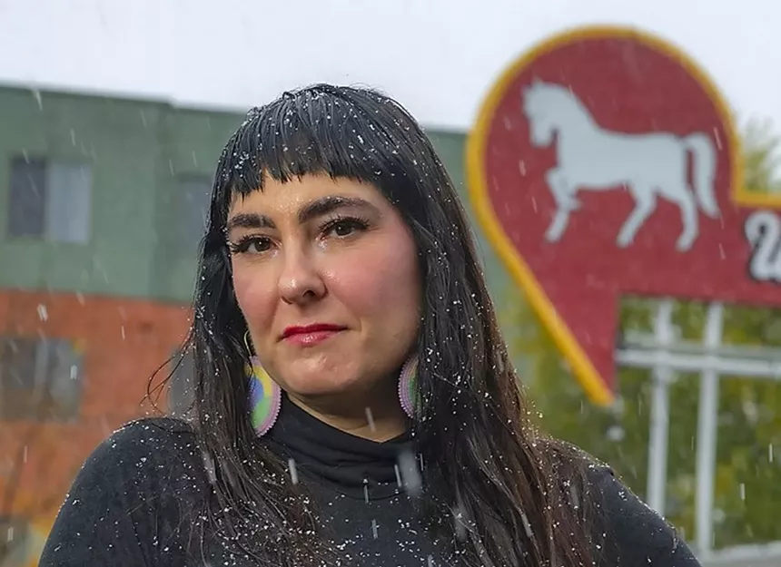 woman by bar in snow