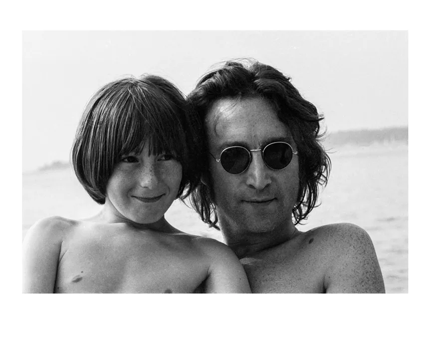 black and white photograph of a young boy and his father