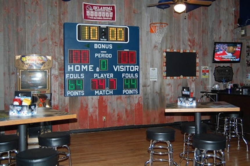 a score board hanging on a wall