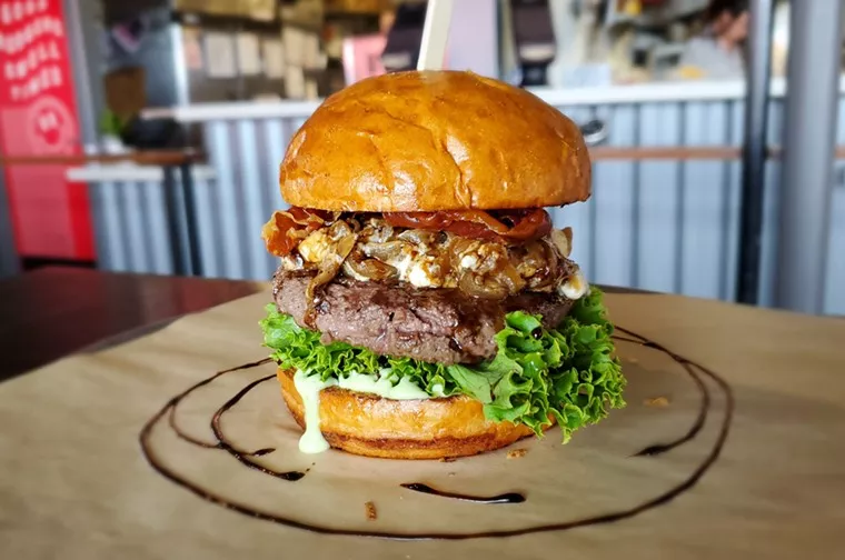a burger on parchment paper