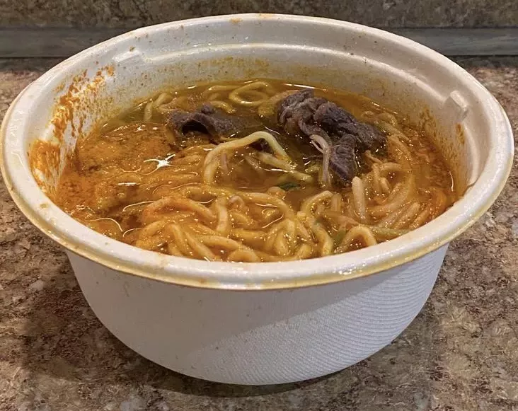 a bowl of soup with noodles
