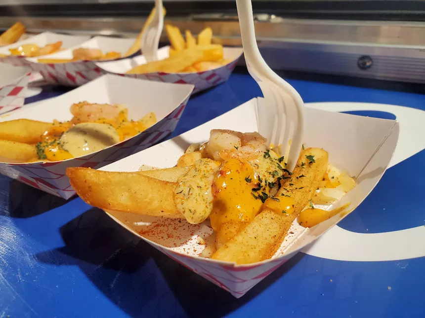 a small cup of fries with gravy