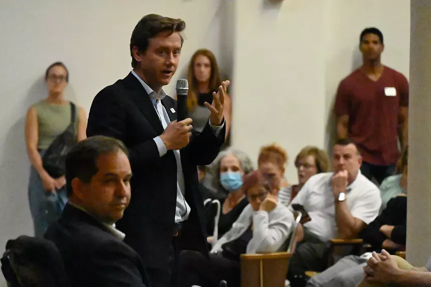 Mayor Mike Johnston talks alongside Councilman Chris Hines.