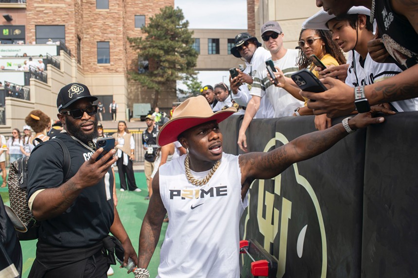 Rapper DaBaby cheering up fans at the Colorado vs. USC football game.