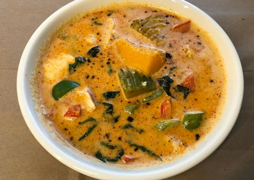 pumpkin curry in a white bowl