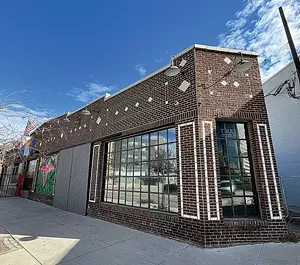 triangular building on sidewalk