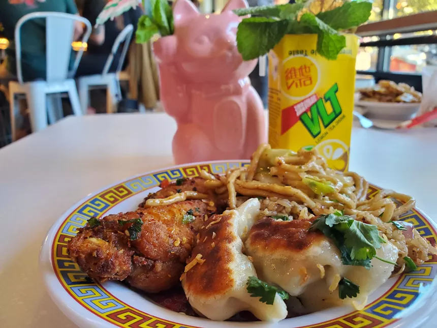 dumplings, noodles and rice on a plate