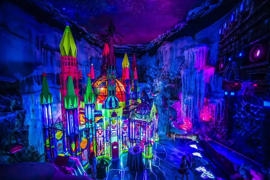 a psychedelic castle in an ice cave
