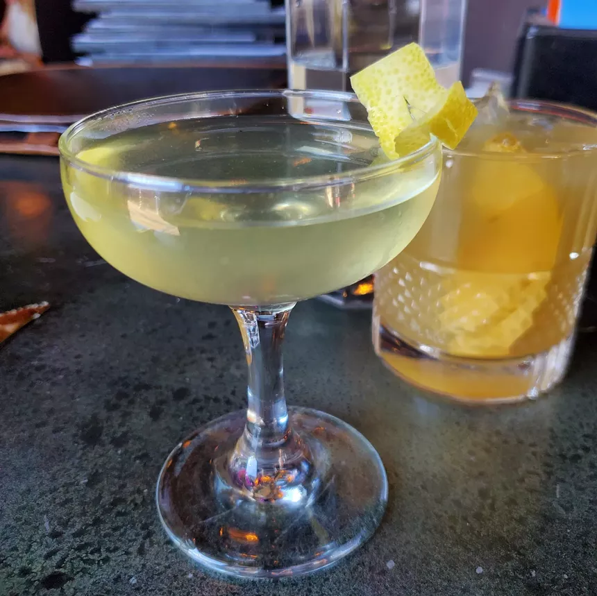 cocktail with a lemon zest garnish