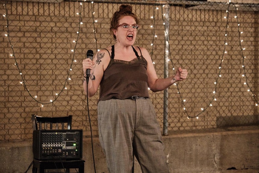 redhead woman comedian with a microphone