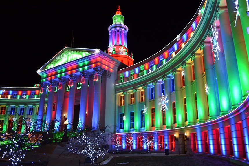 civic building lit up for the holidays.