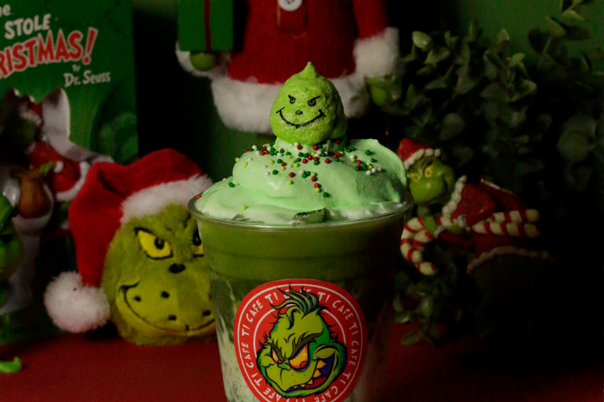 grinch on top of green drink