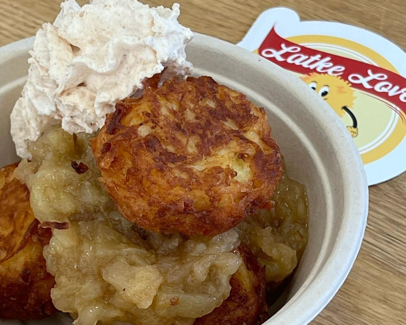 potato pancakes in a bowl on top of apple sauce