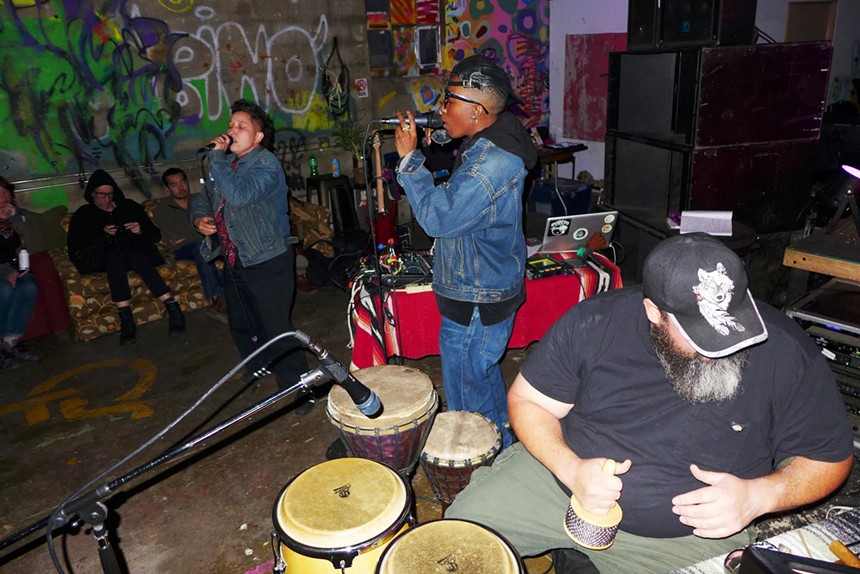 a DIY concert venue with musicians playing
