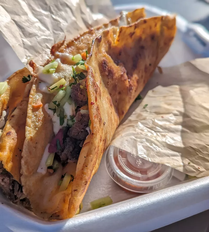 a long tortilla filled with beef