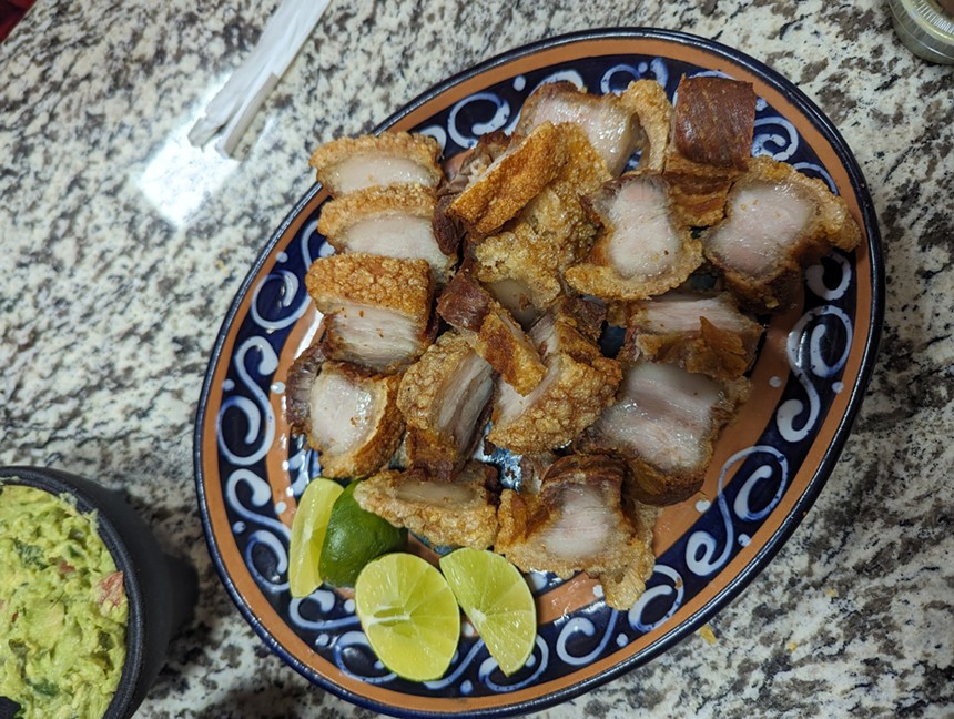 a plate of fried pork belly
