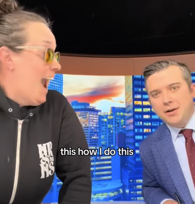 Two people in a news studio.