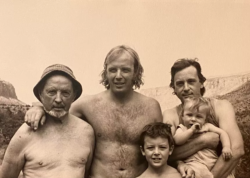 A black and white photograph of a family.