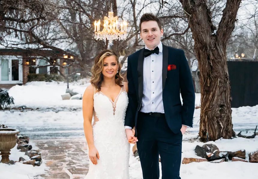 Clare and Cameron pose for a wedding portrait.