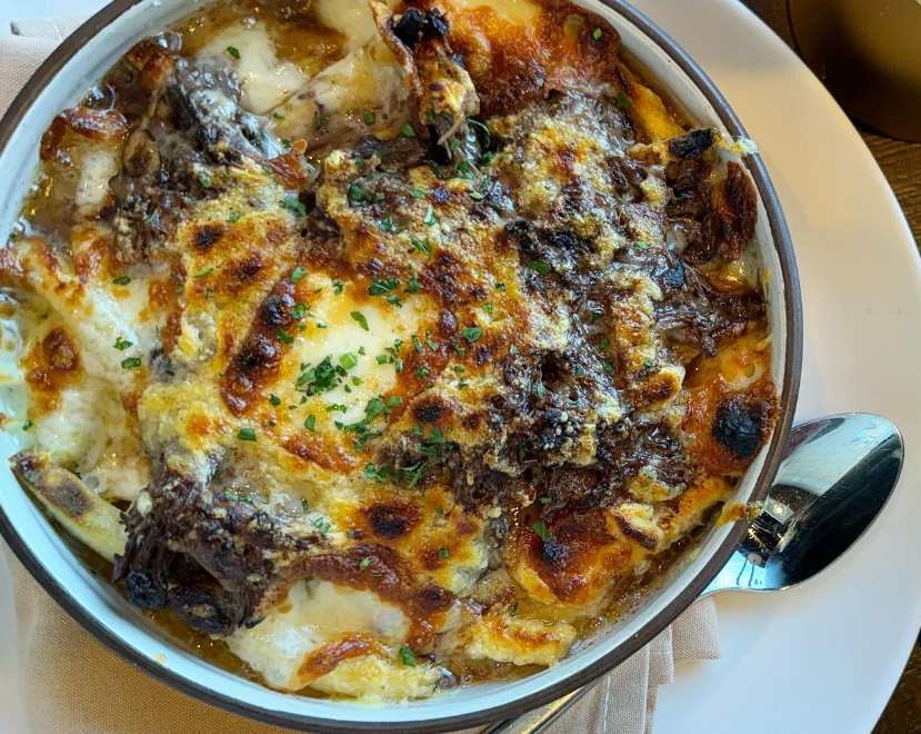 a dish topped with melted cheese