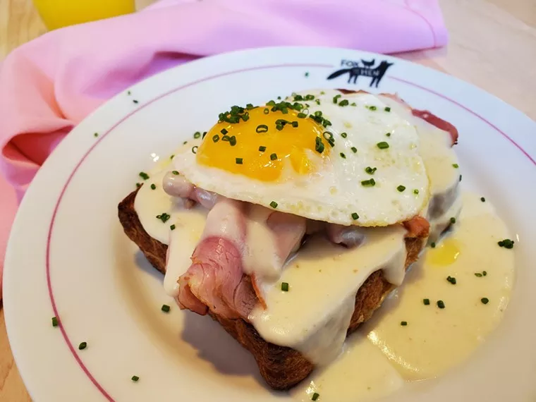 an egg and ham on a piece of toast