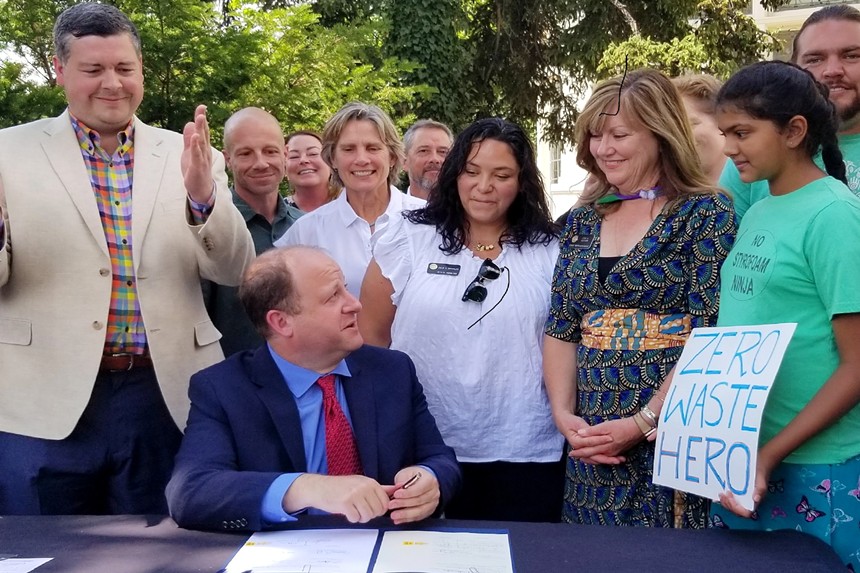 Madhvi Chittoor with Governor Jared Polis and several state legislators at a bill signing in 2021.