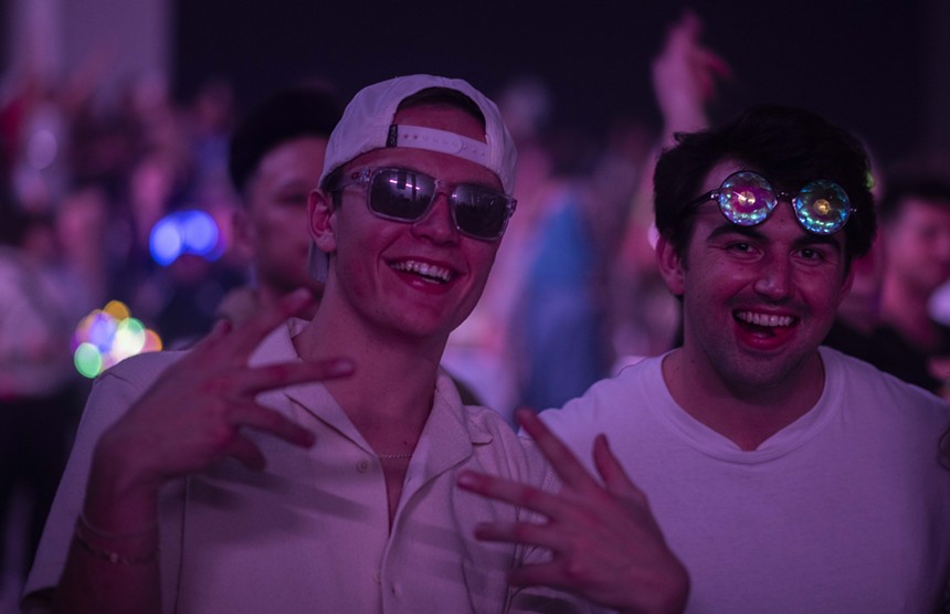 men in hats and sunglasses at a rave