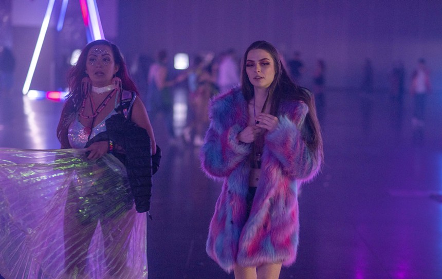 women wearing faux fur at a rave