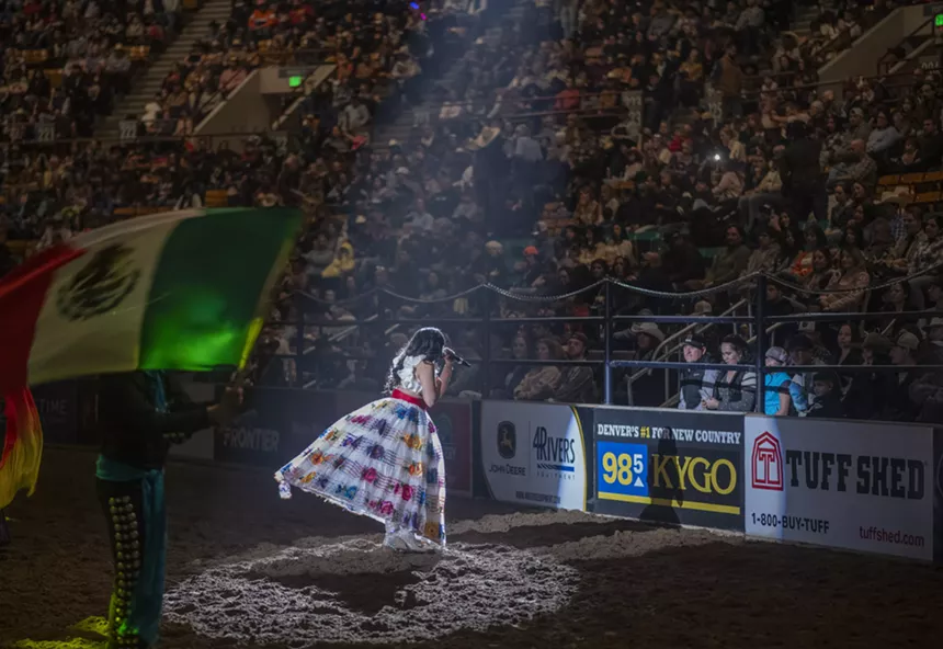 woman singing at rodeo.