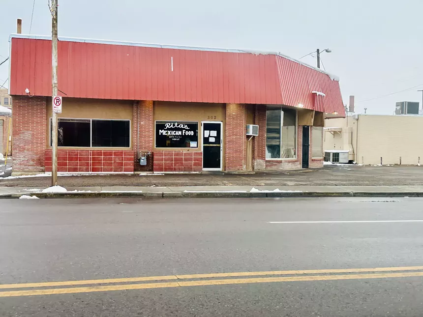 one-story building with red roof