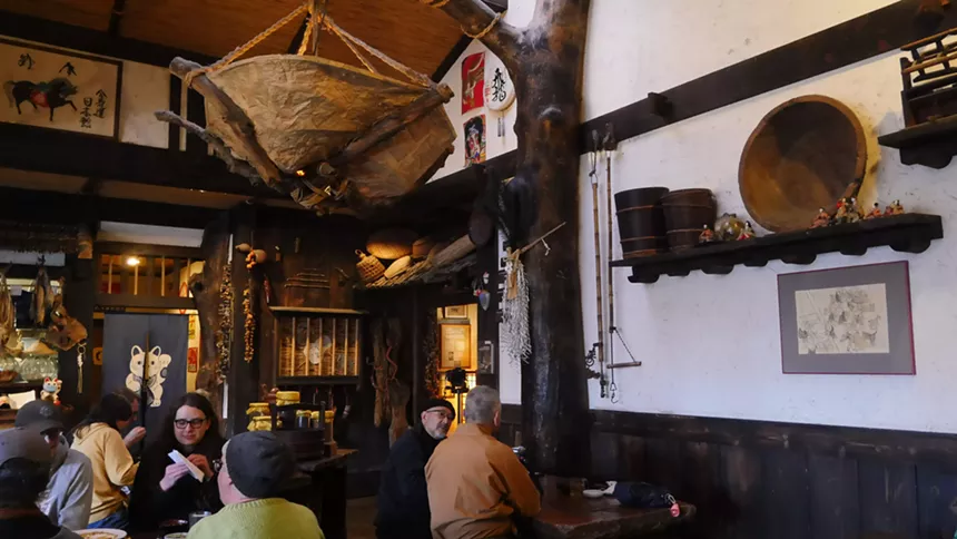 Japanese museum restaurant full of artifacts.
