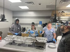 Workers at the Dads of Parker pancake breakfast for the Meyers family.