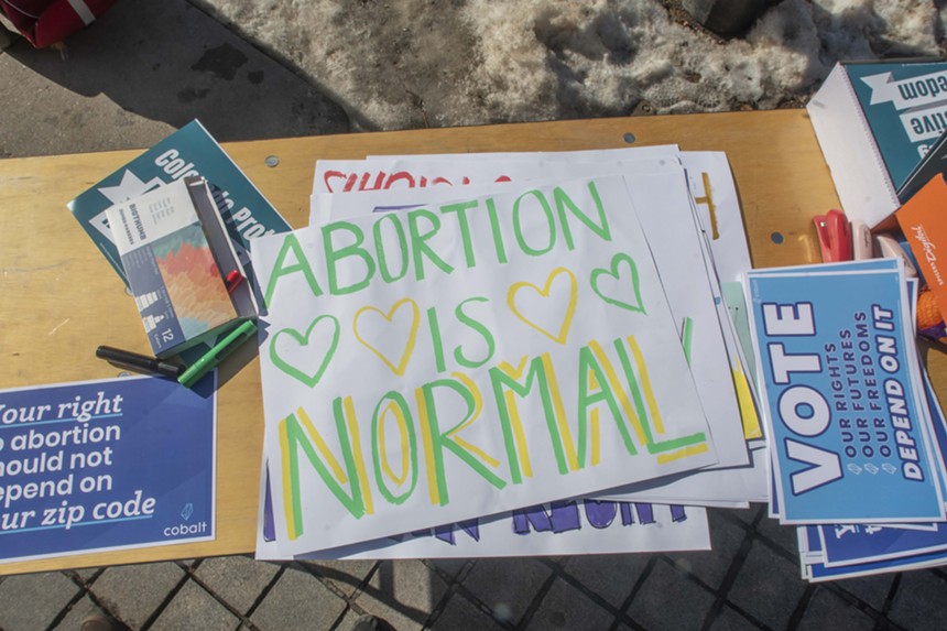 abortion protesters at Colorado capitol with signs