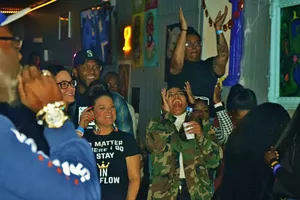 people cheering at an open mic party